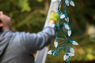 Even today hanging Christmas lights take a bit of effort.