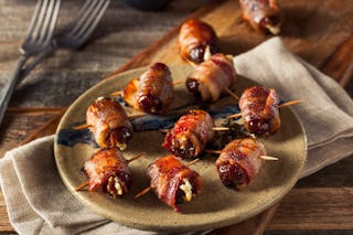 Sweet and savory, bacon wrapped dates are great finger food for holiday parties.
