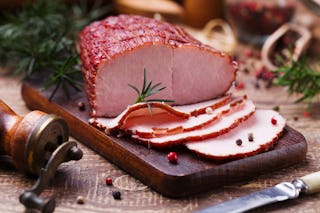A tasty sliced Christmas ham with peppercorns.